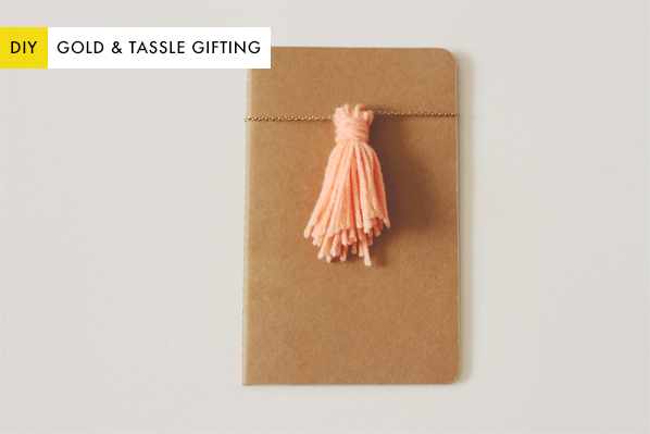 Wrap your gifts in an unconventional style with a gold chain and yarn tassel!